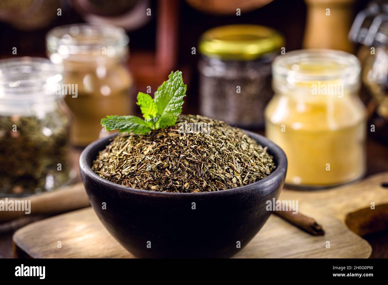ground and crushed mint powder, homemade preparation for mint tea, organic cuisine Stock Photo