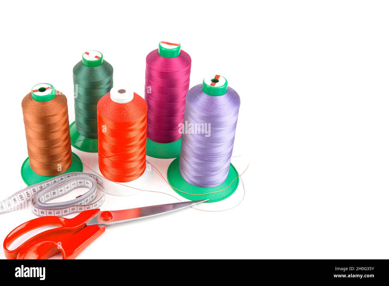 Colorful sewing thread, background, tailor-related images. On a white background Stock Photo