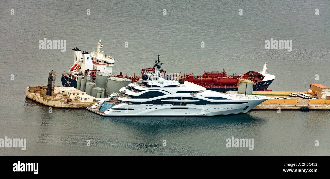 The $500m Super-yacht Al-Lusail, owned by the Sheikh of Quatar, and the Chemical Tanker Fionia Swan, owned by Uni-tankers and registered in Denmark. Stock Photo