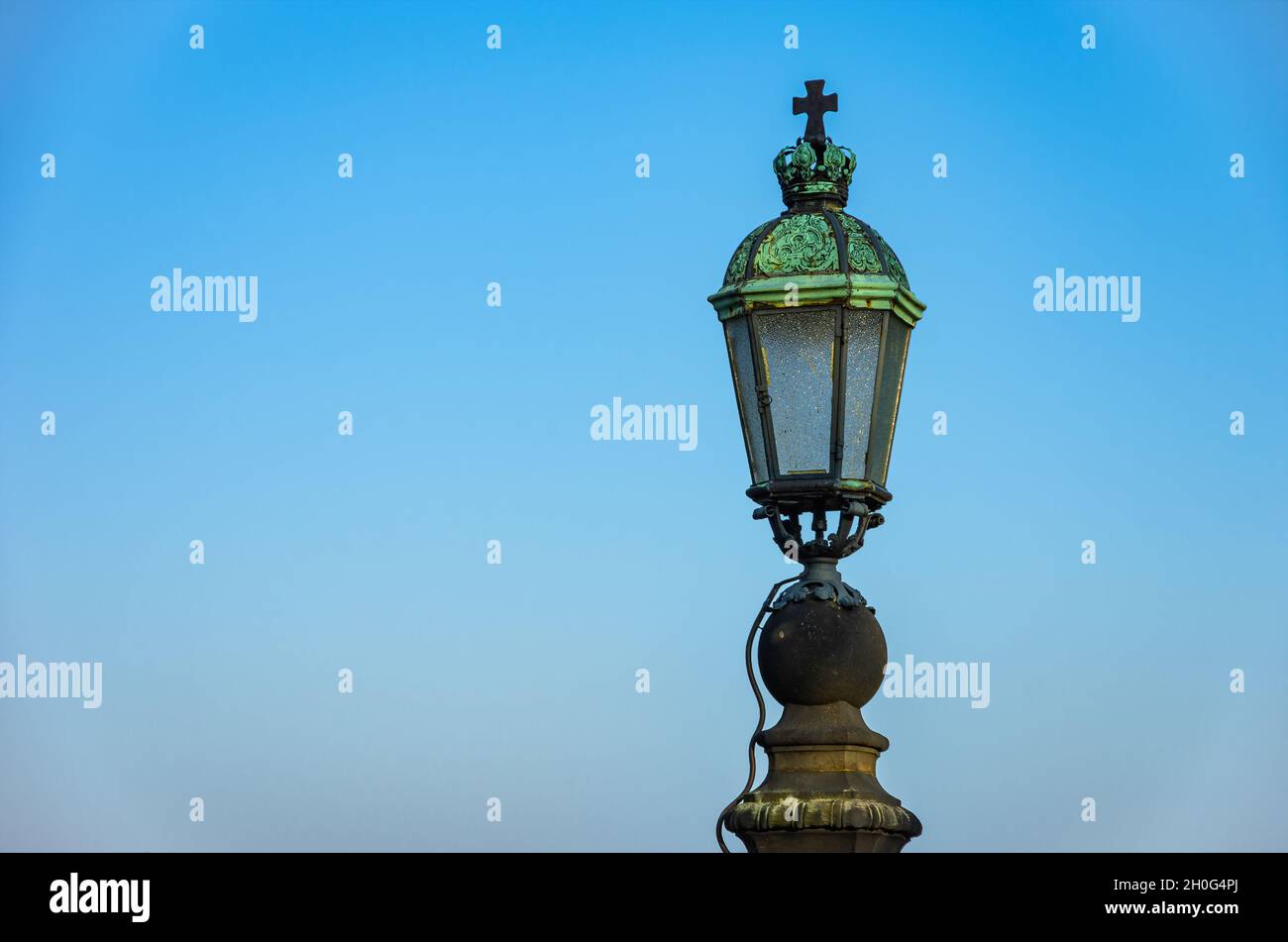 Old historical street lighting using the example of a street lamp in front of the church of Moritzburg near Dresden, Saxony, Germany. Stock Photo