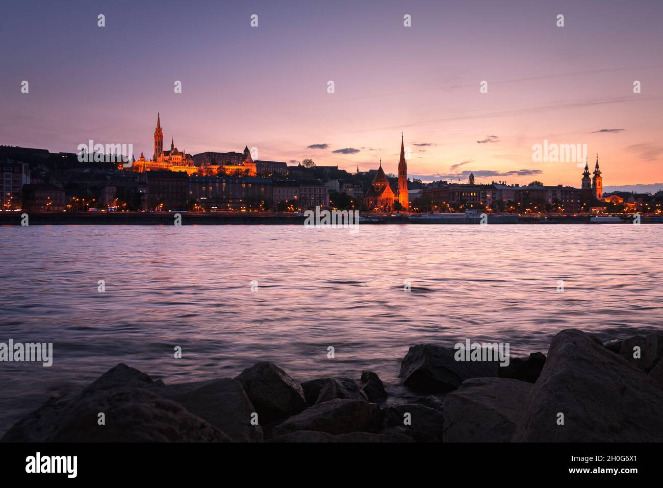 Budapest city skyline from the Danube river bank at sunset, Budapest ...