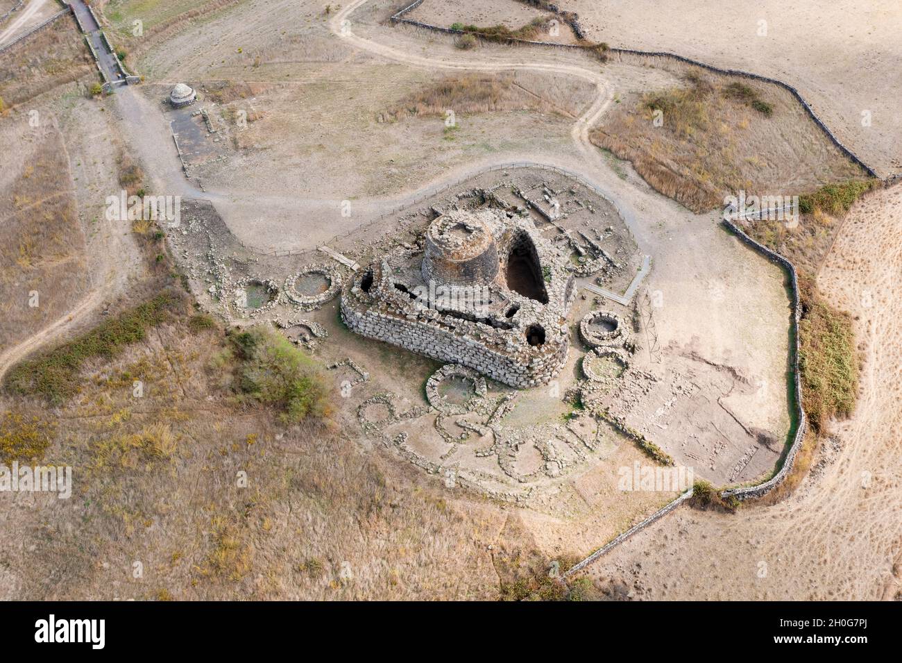 View from above, stunning aerial view of the ancient Santu Antine Nuraghe. Santu Antine Nuraghe is one of the largest Nuraghi in Sardinia, Italy. Stock Photo