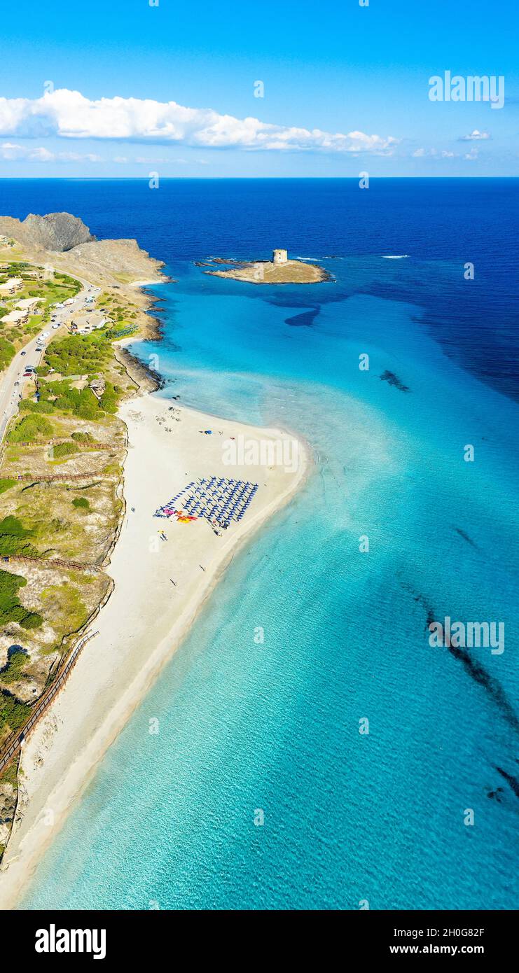View from above, aerial shot, stunning panoramic view of La Pelosa Beach bathed by a turquoise, crystal clear water. Stock Photo