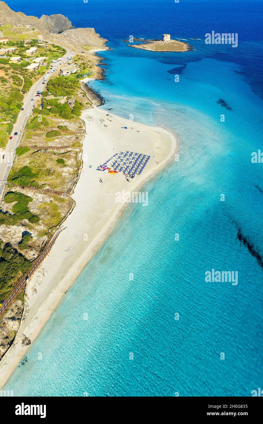 View from above, aerial shot, stunning panoramic view of La Pelosa Beach bathed by a turquoise, crystal clear water. Stock Photo