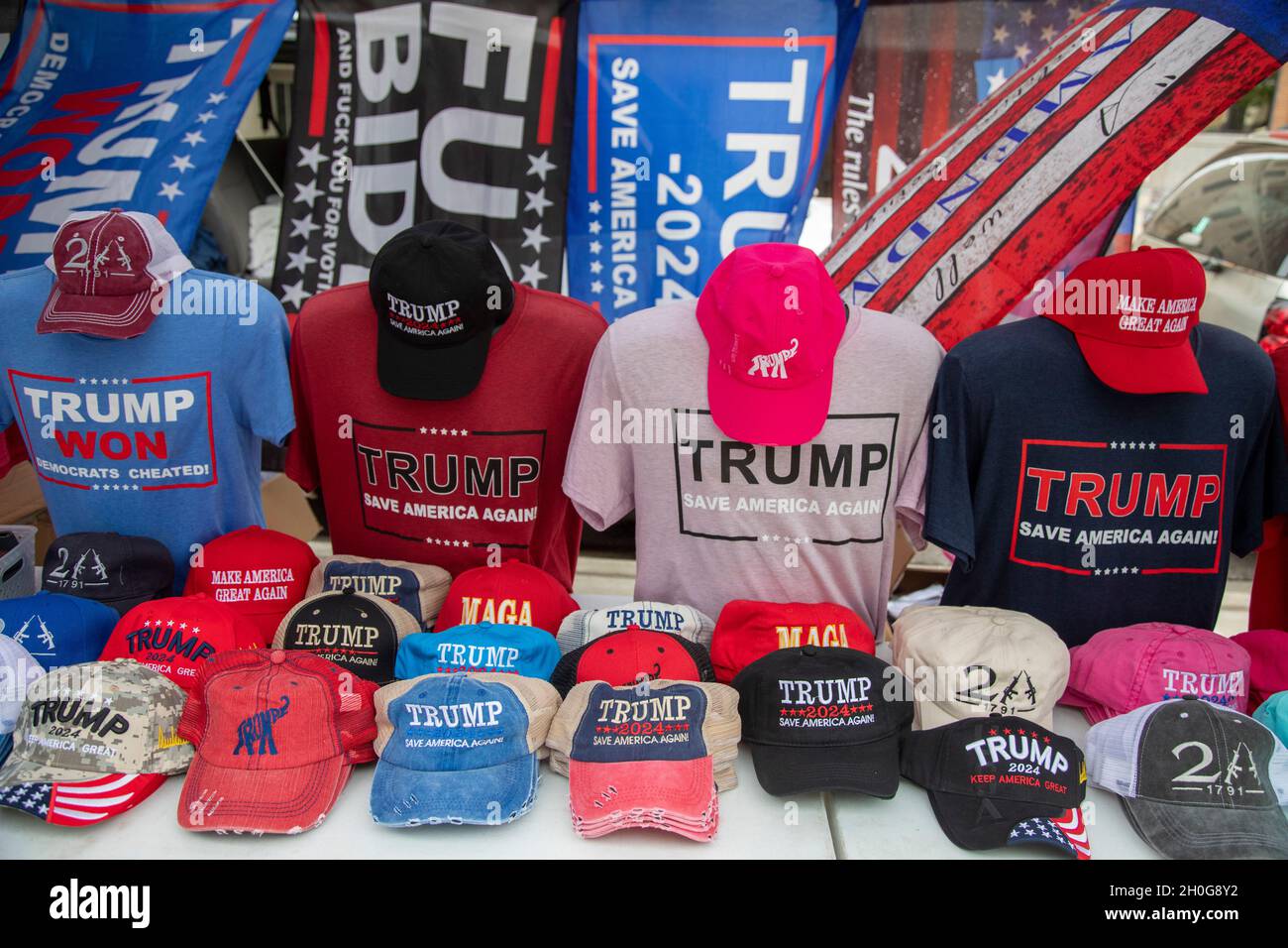 Lansing, Michigan, USA. 12th Oct, 2021. Trump merchandise on sale at a rally at the Michigan State Capitol demands a 'forensic audit' of the 2020 presidential election results. Former President Trump charges that voter fraud was the reason he lost the election in Michigan by more than 150,000 votes. Credit: Jim West/Alamy Live News Stock Photo