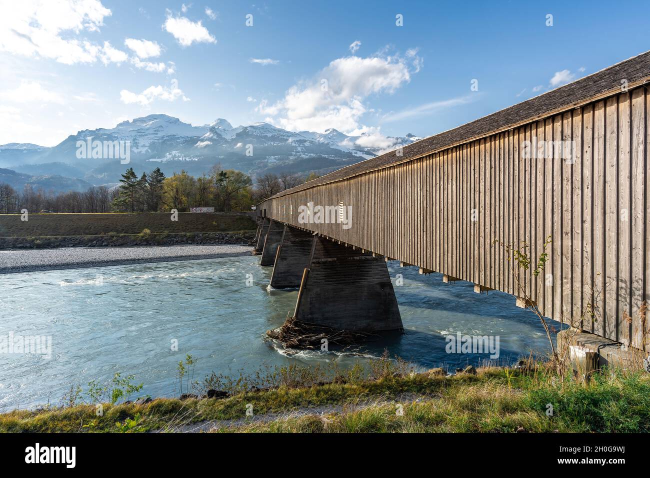Old Rhine Bridge (Alte Rheinbrucke) with Appenzell Alps on background - Vaduz, Liechtenstein Stock Photo