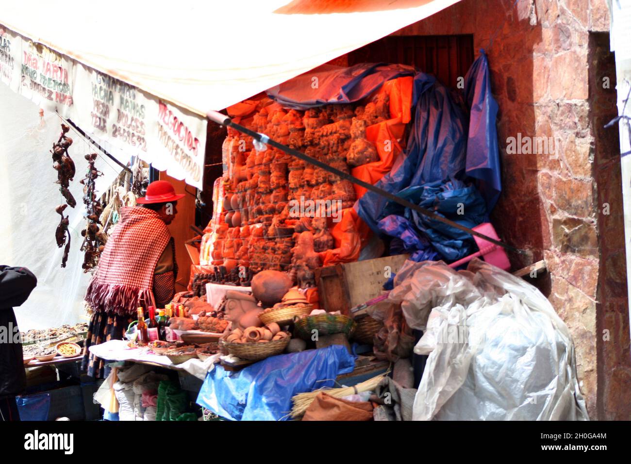 A local woman at a market stall in the Witches' Market, La Paz, Bolivia Stock Photo