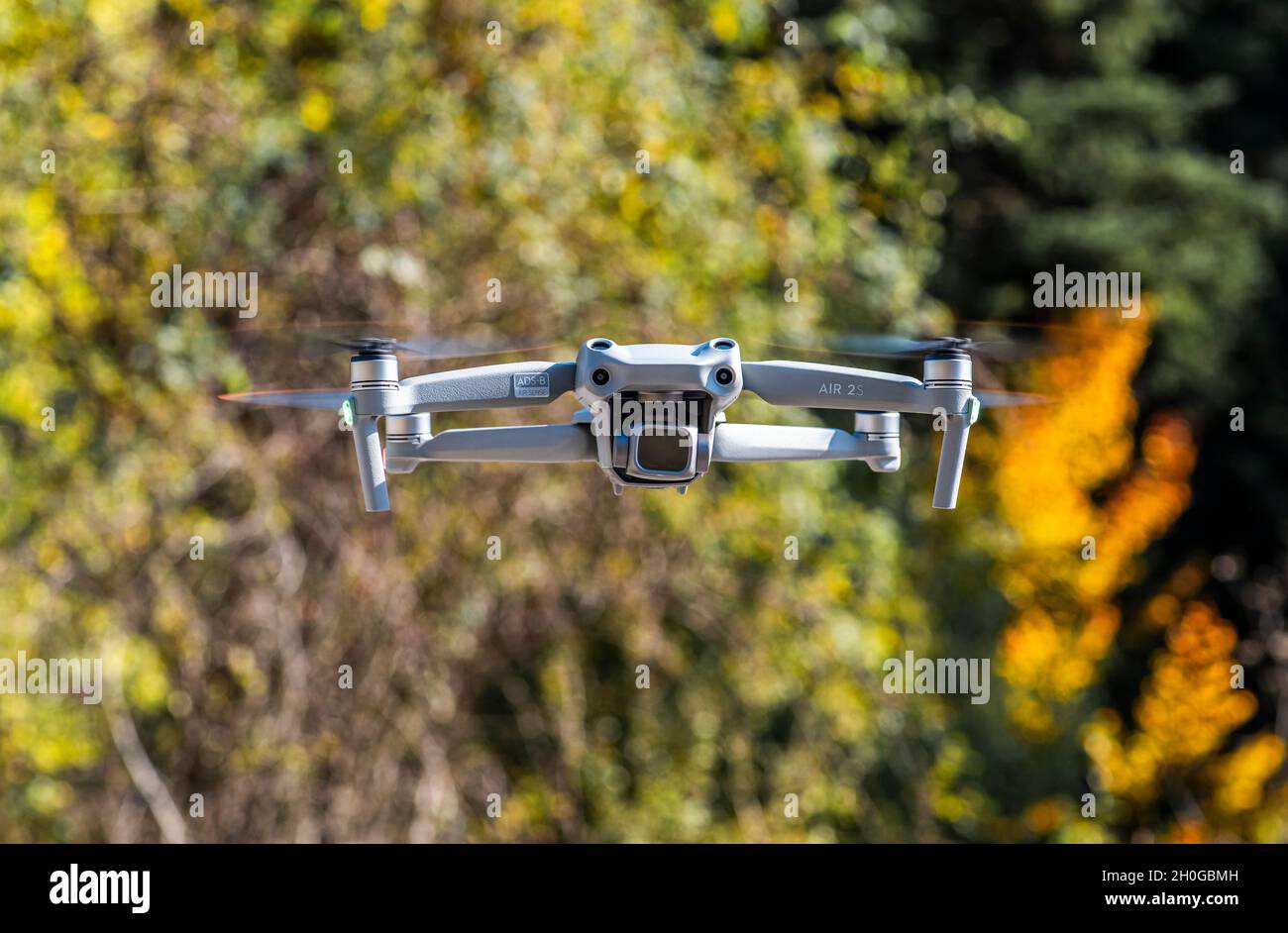 ISTANBUL, TURKEY - OCTOBER 11, 2021: DJI Air 2S Drone flying with green background. Stock Photo