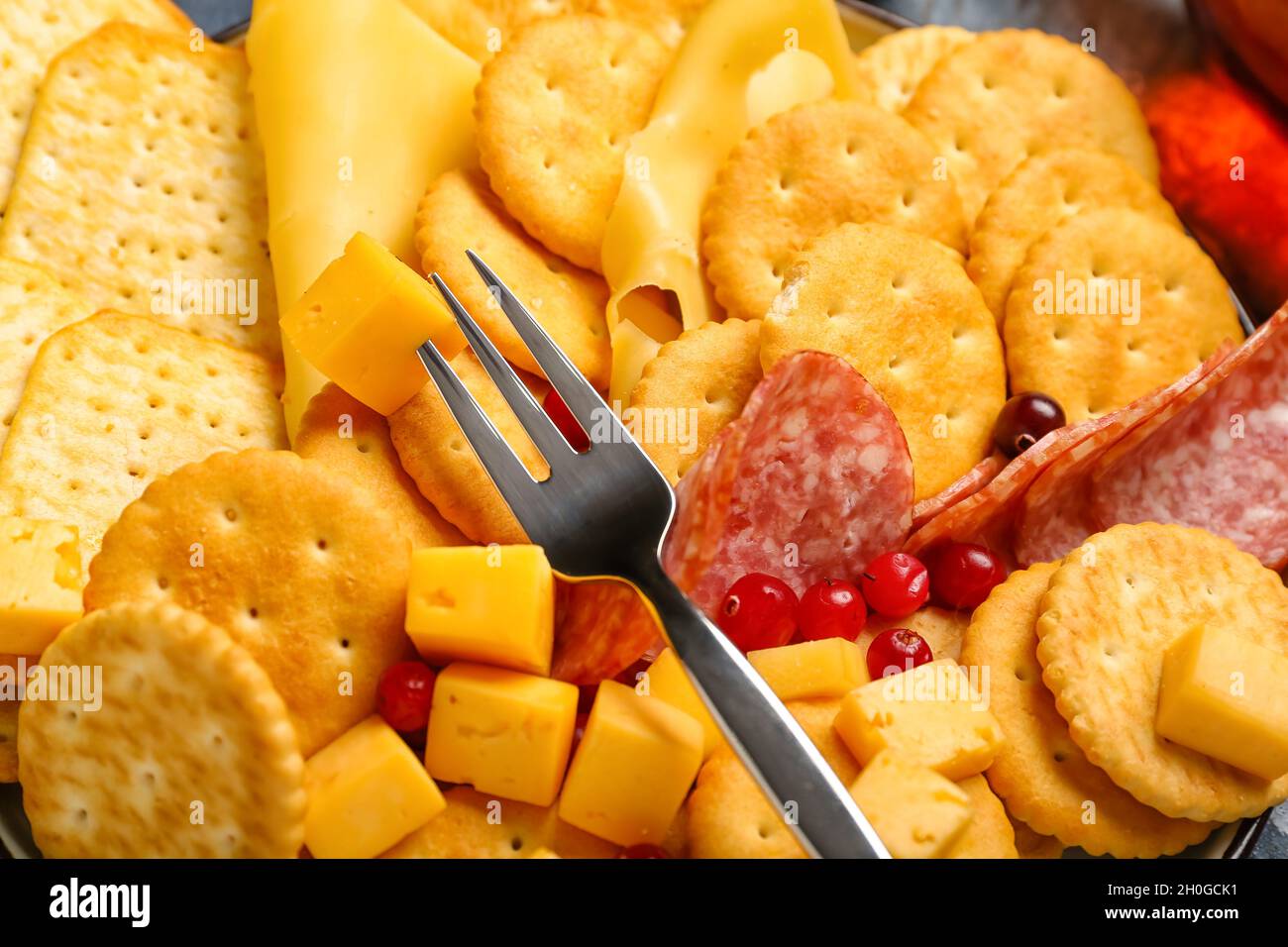 Platter with crunchy crackers and cheese, closeup Stock Photo Alamy