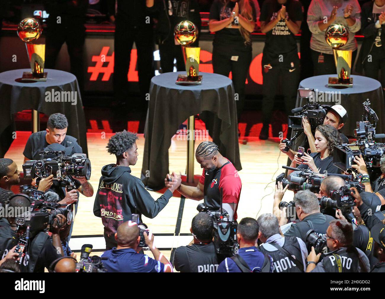 Miami, USA. 09th Apr, 2019. The Miami Heat's Dwyane Wade with his son, Zaire, as he prepares to start the ceremony for his last game as the Heat play host to the Philadelphia 76ers at the AmericanAirlines Arena in Miami on Tuesday, April 9, 2019. (Photo by Charles Trainor Jr./Miami Herald/TNS/Sipa USA) Credit: Sipa USA/Alamy Live News Stock Photo