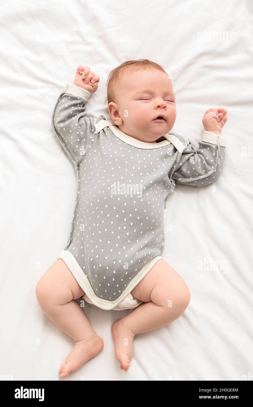 Little baby sleeping on bed Stock Photo Alamy