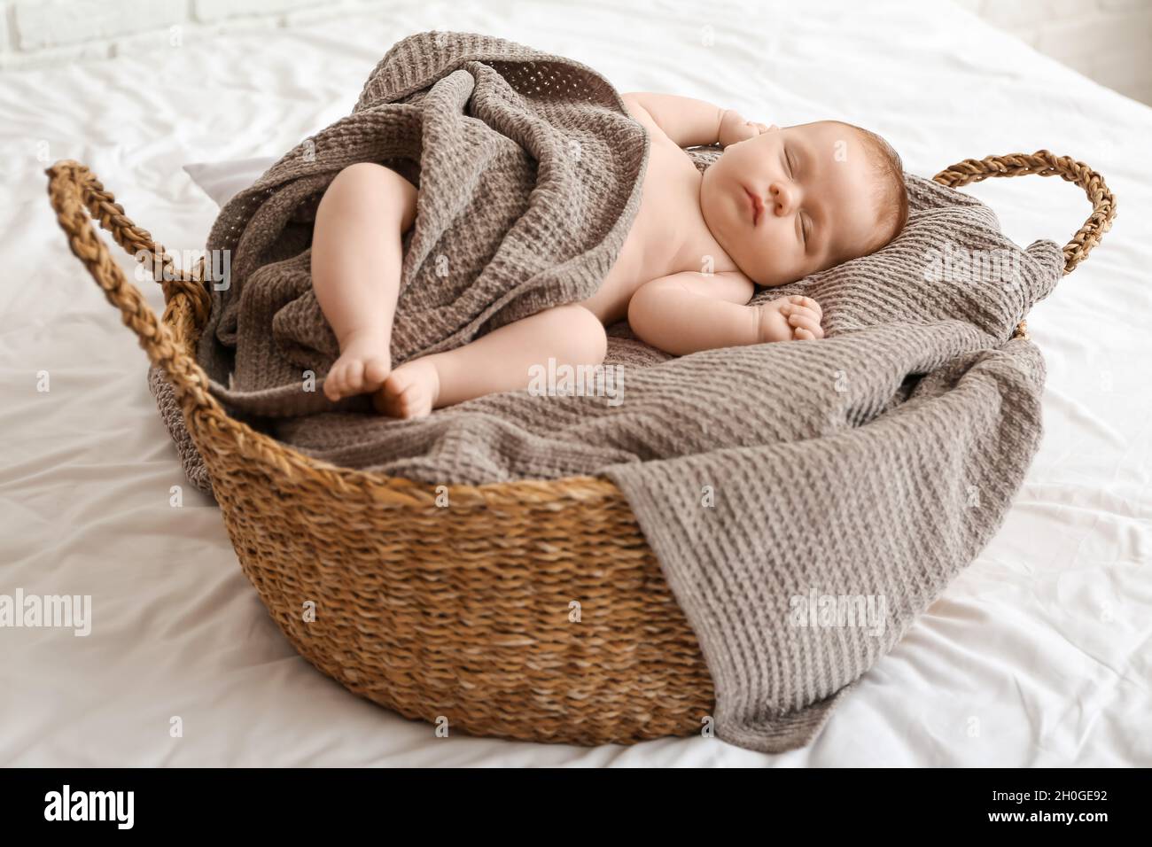 Little baby sleeping in basket Stock Photo Alamy