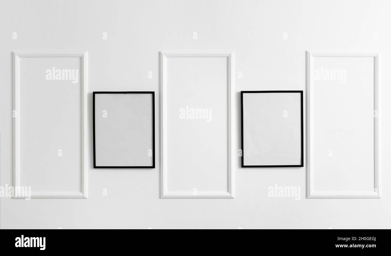 Blank poster frames hanging on stylish wall Stock Photo Alamy