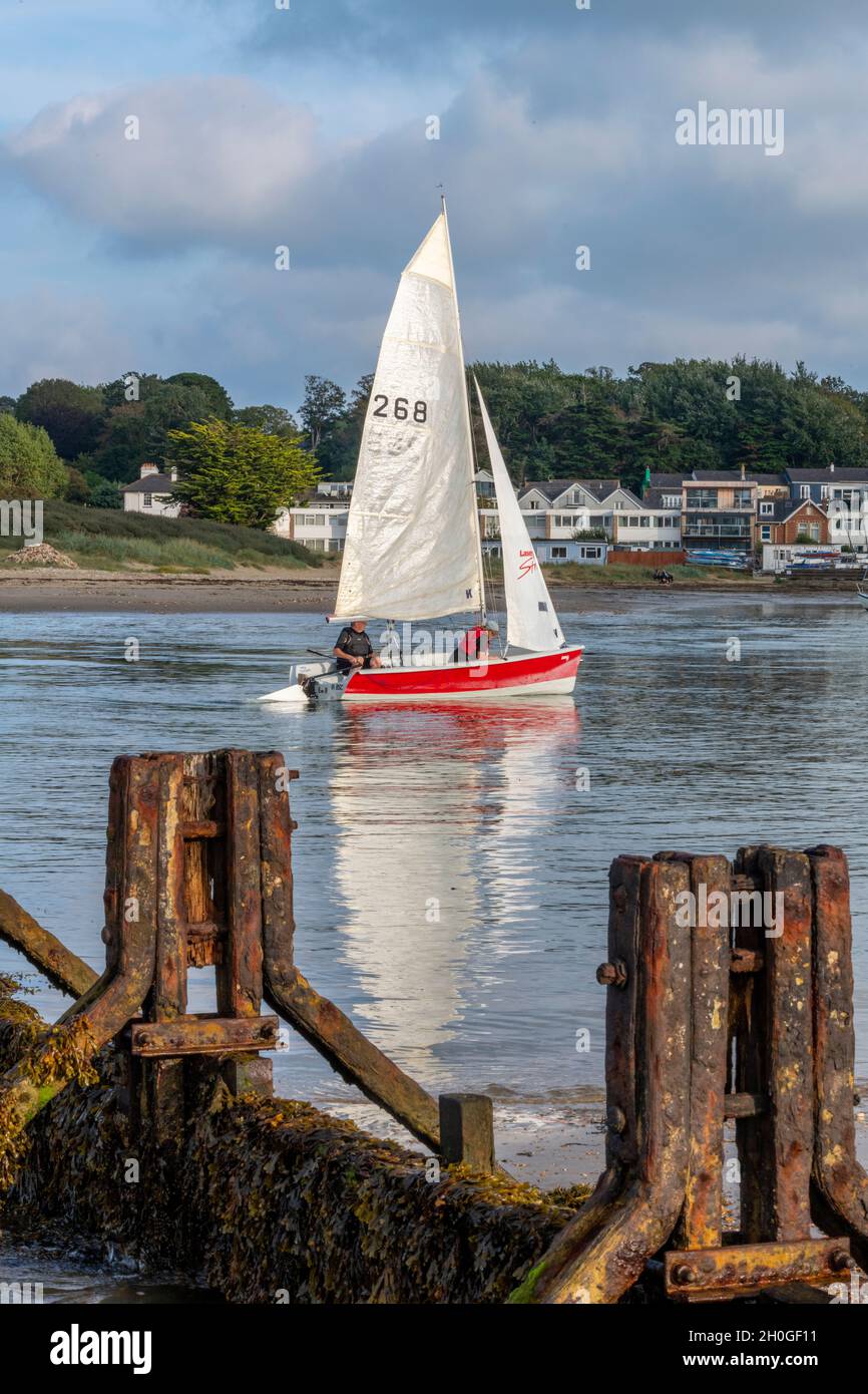 isle of wight, small red dinghy entering bembridge harbour on the isle