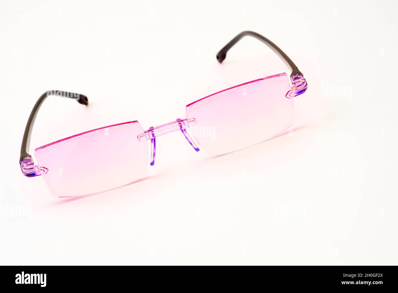 Pink glasses for vision on a white background Stock Photo