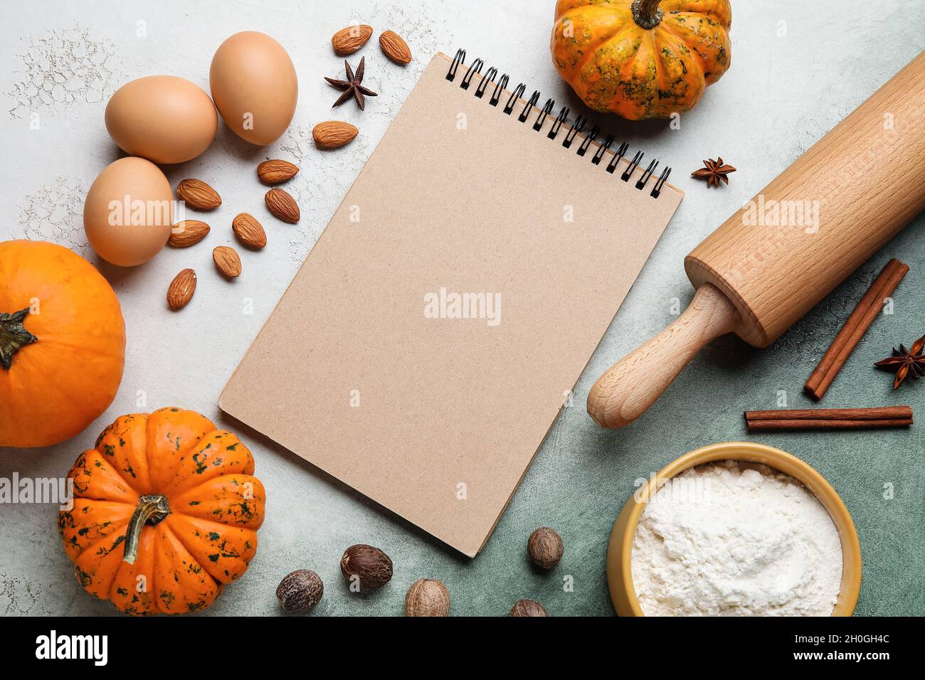 Ingredients for preparing pumpkin pie and notebook on table Stock Photo