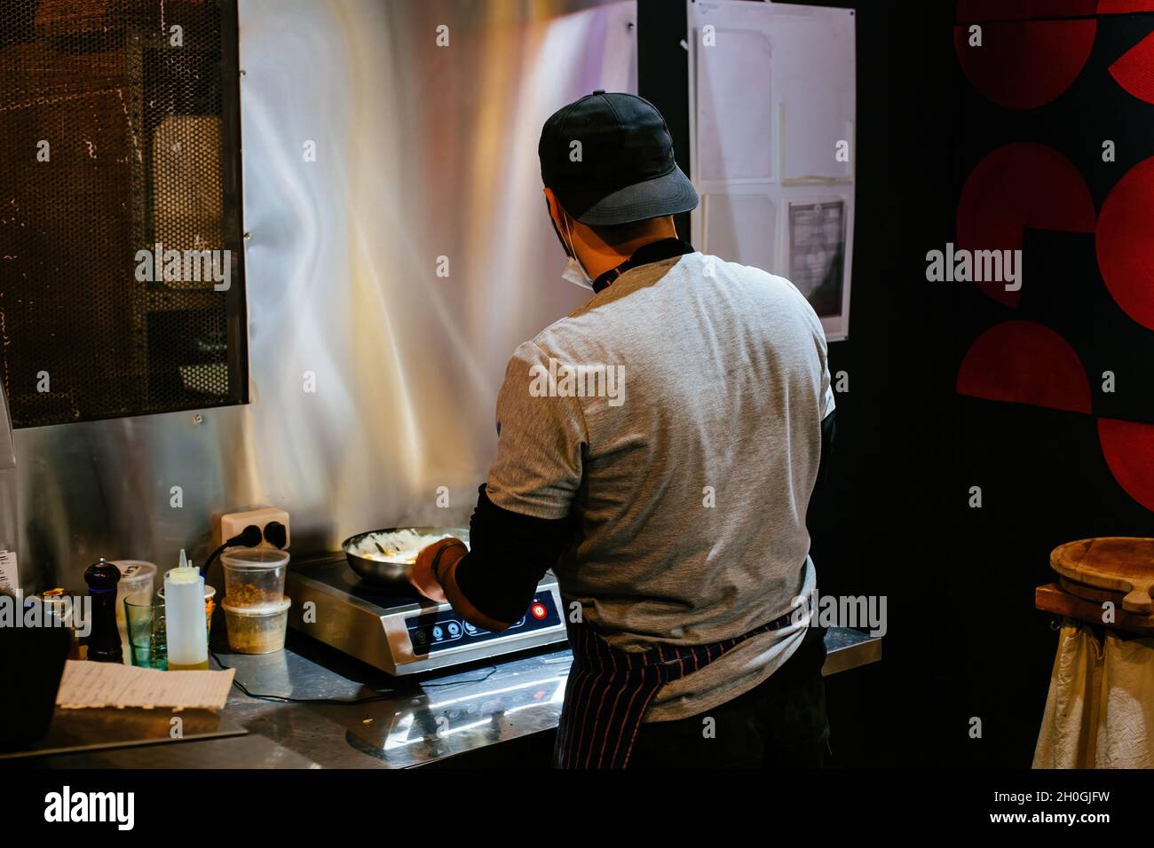 Chef is working in the restaurant kitchen. Stock Photo