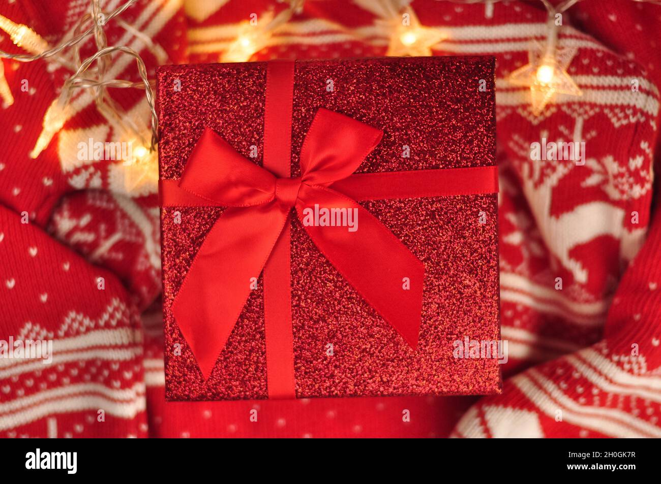 Red present box with bow. Gift for Christmas  Stock Photo