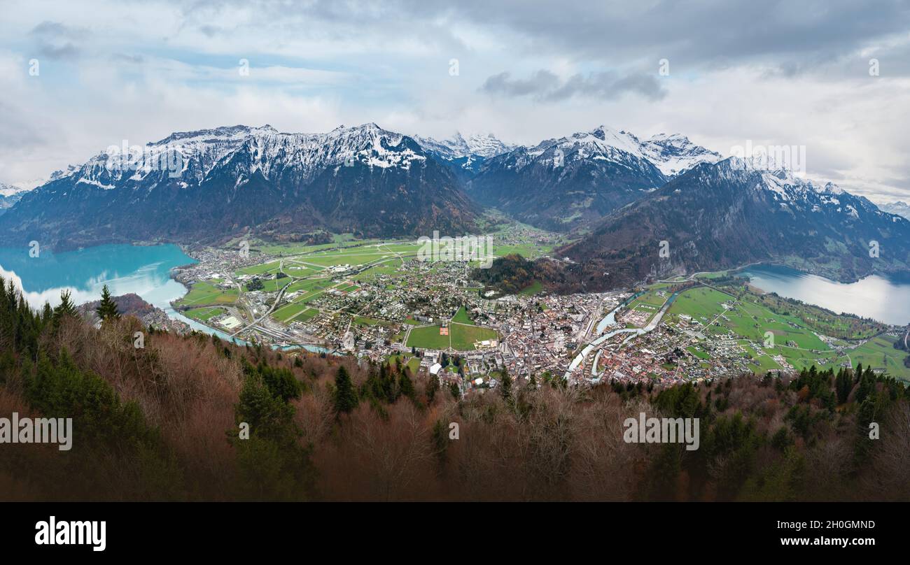 Panoramic aerial view of Interlaken and Unterseen between Lakes Thun and Brienz with Bernese Alps Mountains on background - Interlaken, Switzerland Stock Photo