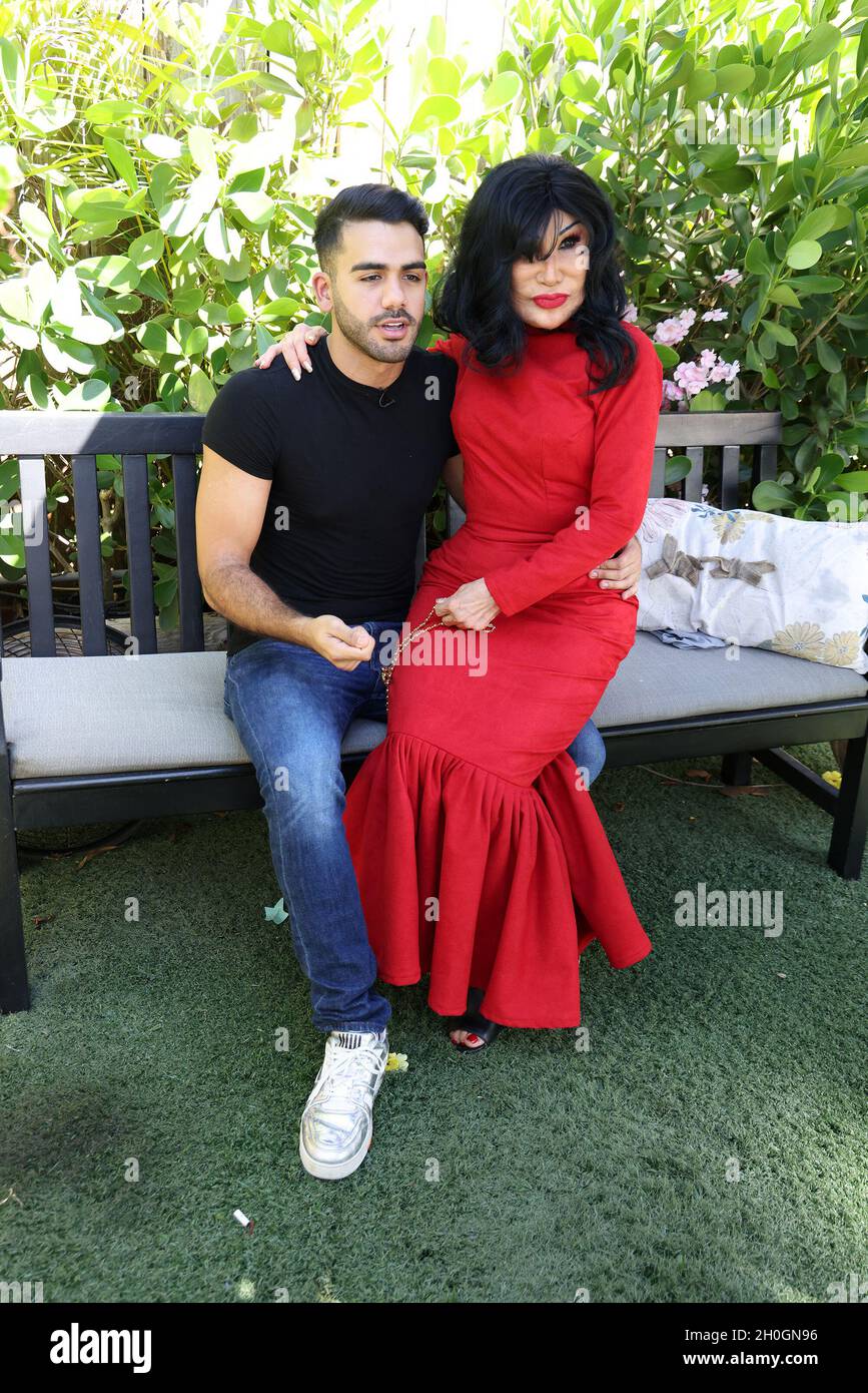 MIAMI, FL - OCT 12: Carlos Adyan and actress Lyn May are seen during