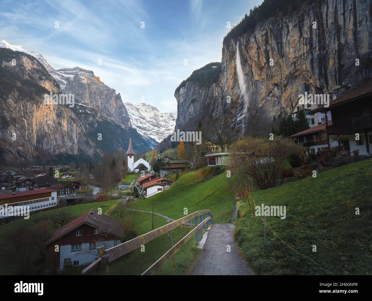 Village Church in a beautiful valley in the middle of Alps Mountains - Lauterbrunnen, Switzerland Stock Photo