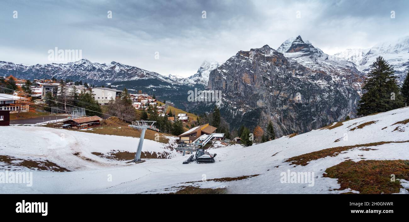 Panoramic view of Murren Village with Alps Mountains on background - Jungfrau, Eiger and Mannlichen Mountains - Murren, Switzerland Stock Photo