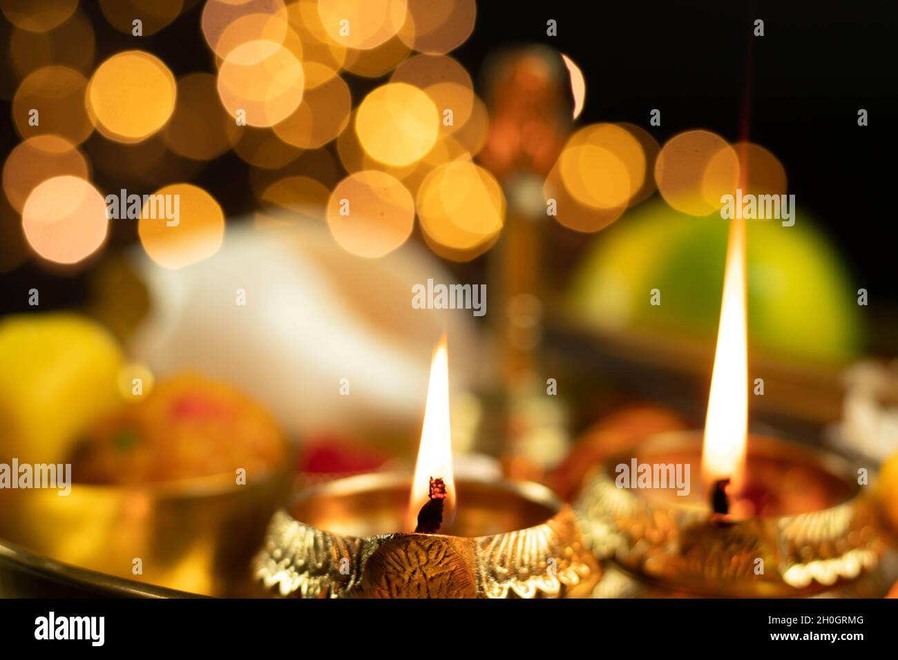 Illuminated Metal Brass Lamp Called Diya Deep Or Dia Glowing With Bokeh. Theme For Diwali, Navratri, Dussehra Puja, New Year, Deepawali, Karva Chauth, Stock Photo