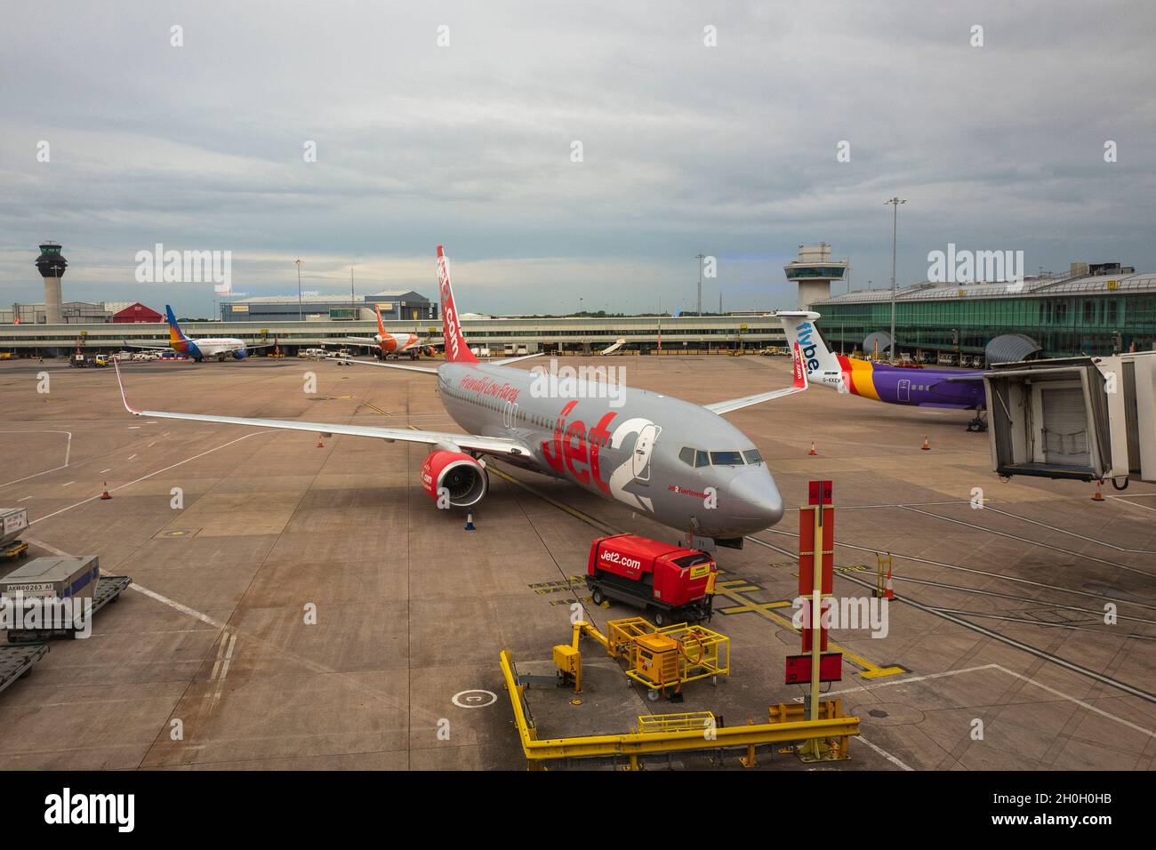 A Jet2 airplane outside a terminal at Manchester Airport on August 04