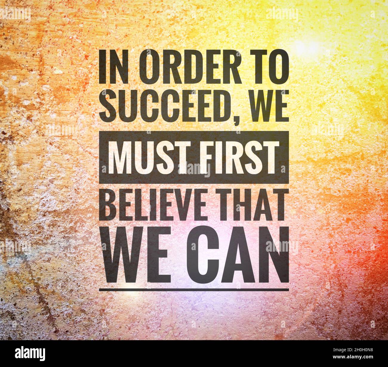 Quote. In order to succeed we must first believe that we can. Stock Photo