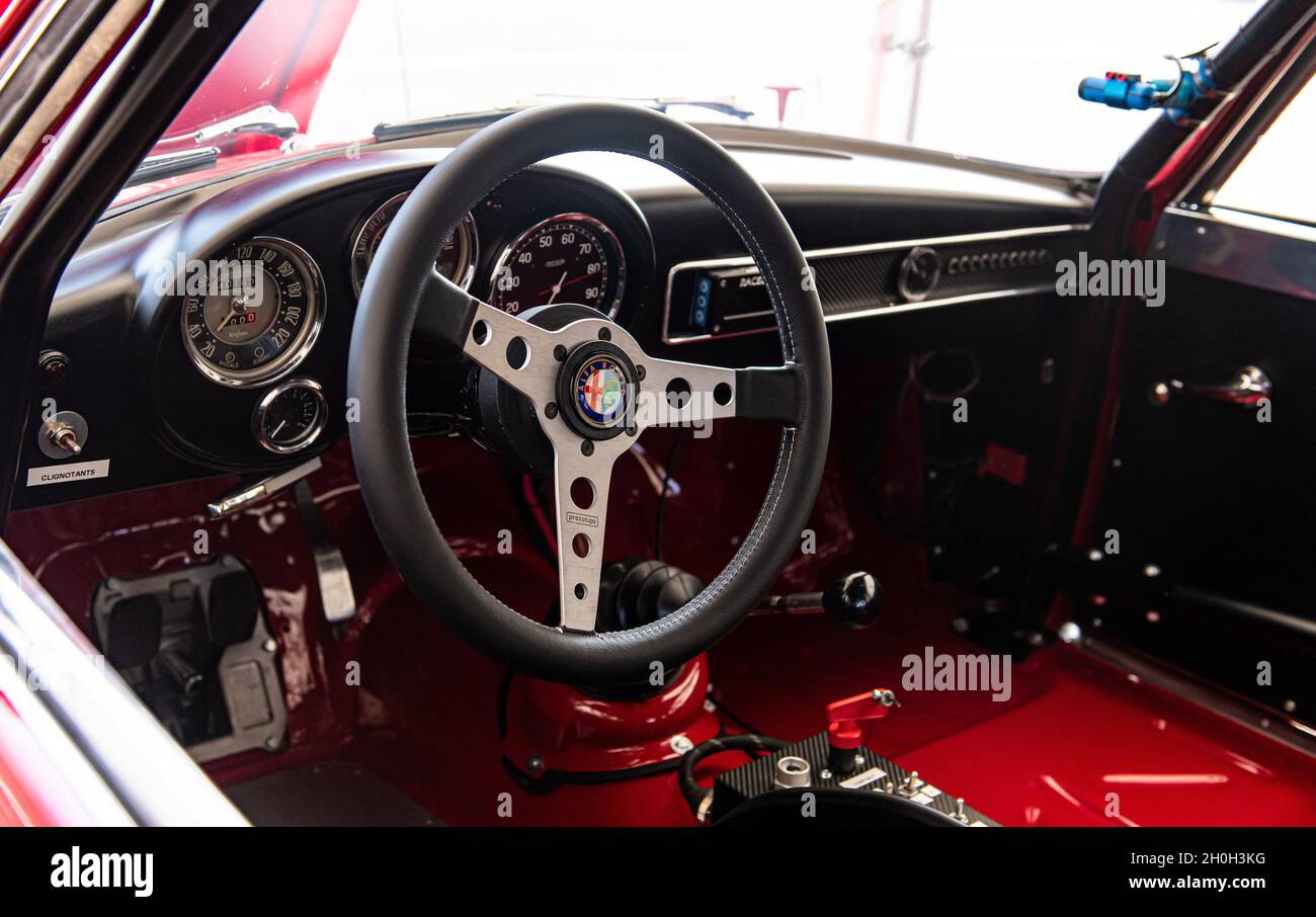 Italy, september 11 2021. Vallelunga classic. Vntage car cockpit steering wheel and dashboard with Alfa Romeo logo Stock Photo
