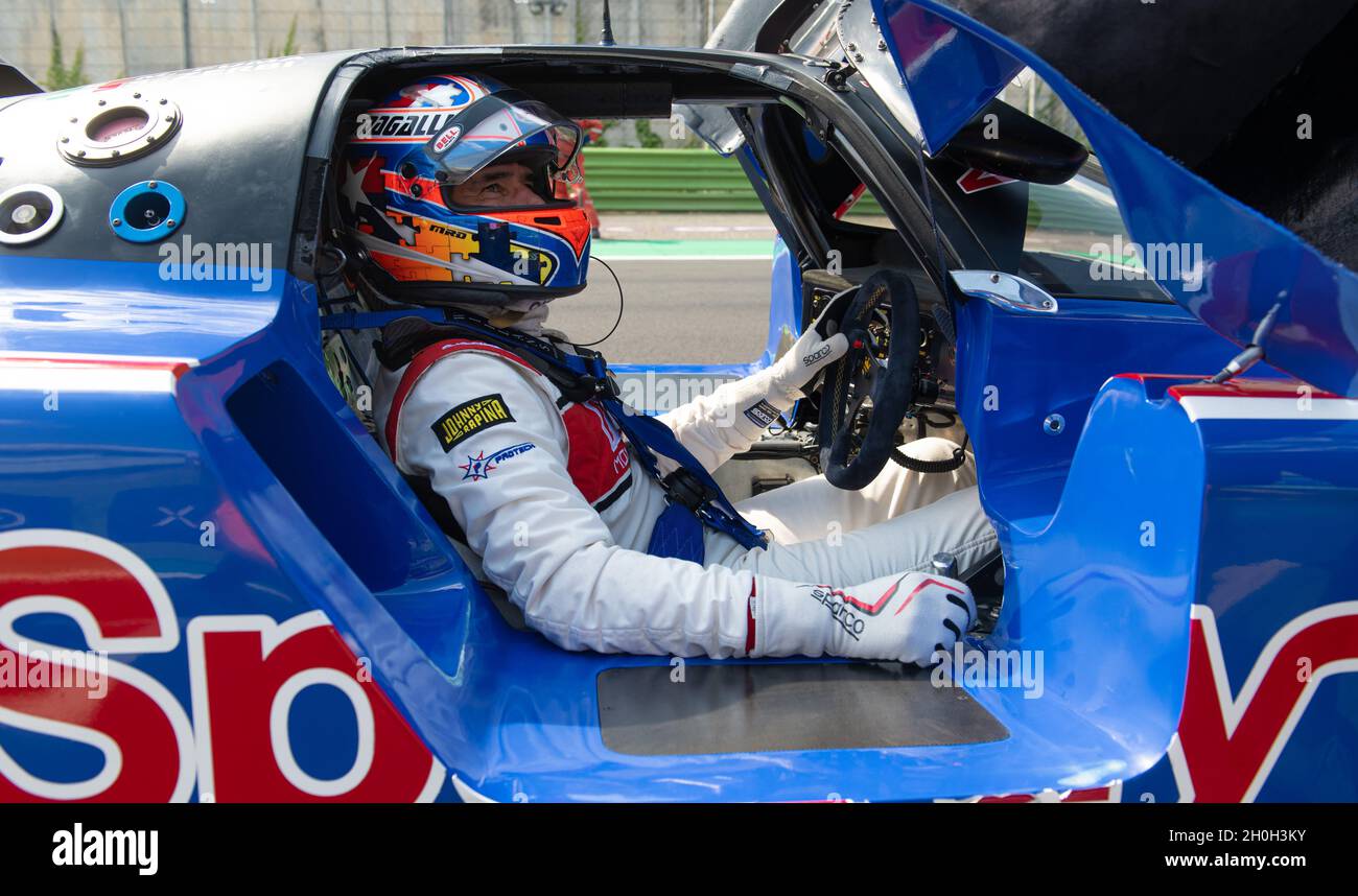 Italy, september 11 2021. Vallelunga classic. Driver in racing suit and helmet sitting in prototype race car cockpit Stock Photo