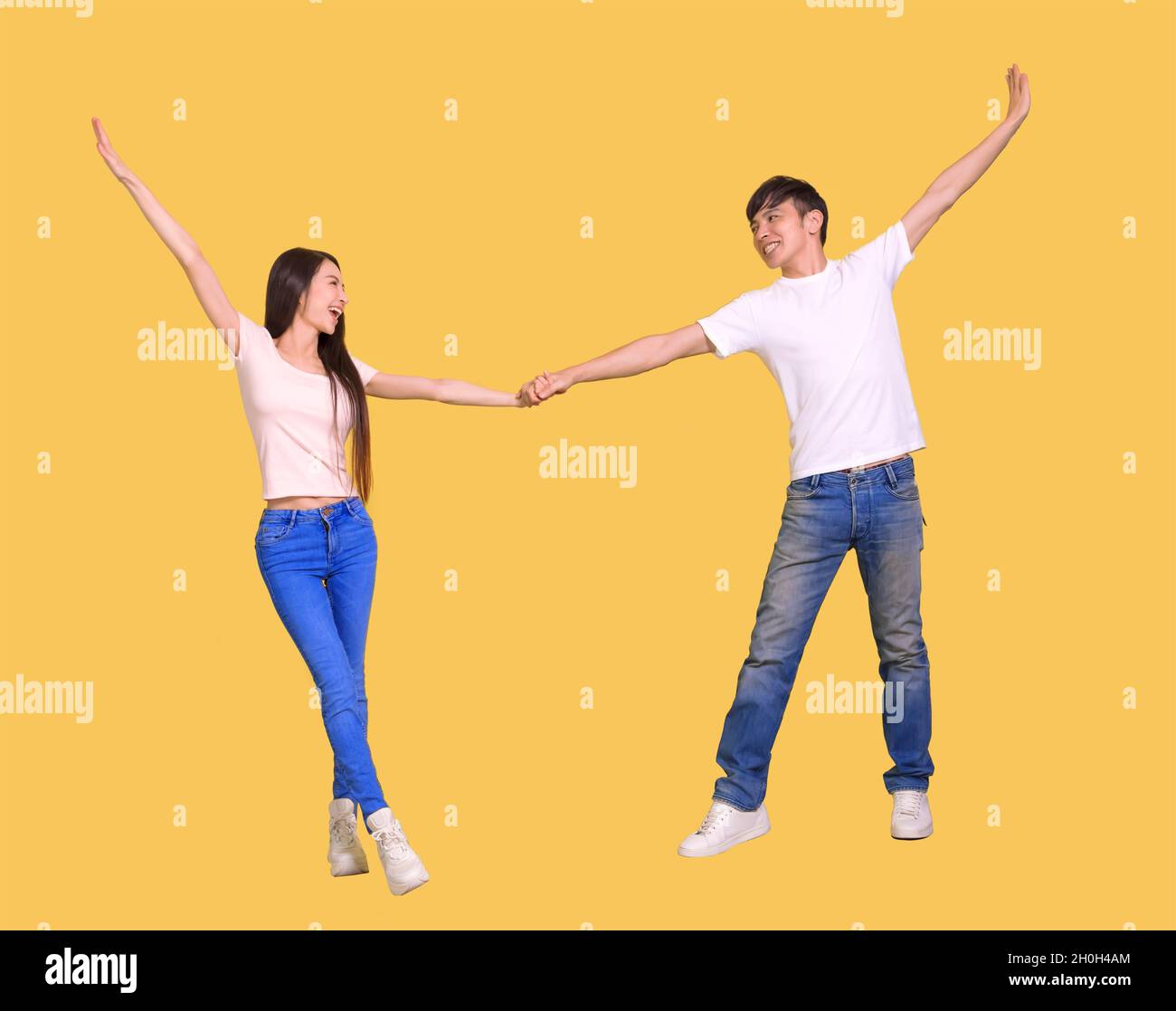 young  couple being happy and dancing Stock Photo
