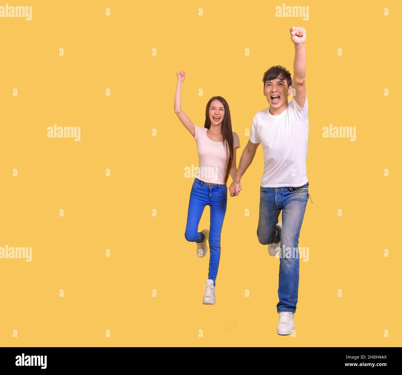 young  couple being happy and running Stock Photo