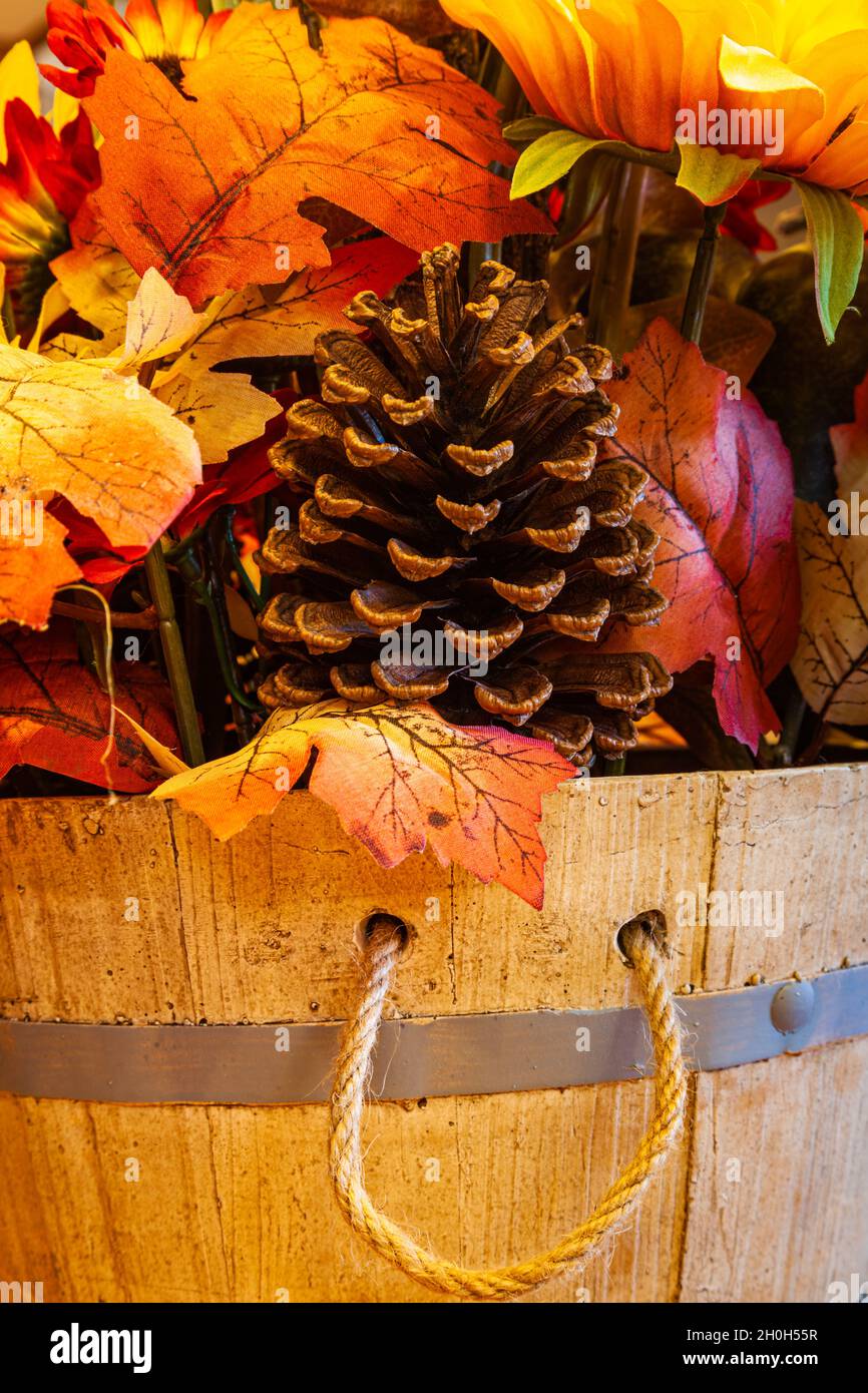 Using artificial leaves and flowers for an autumn display Stock Photo