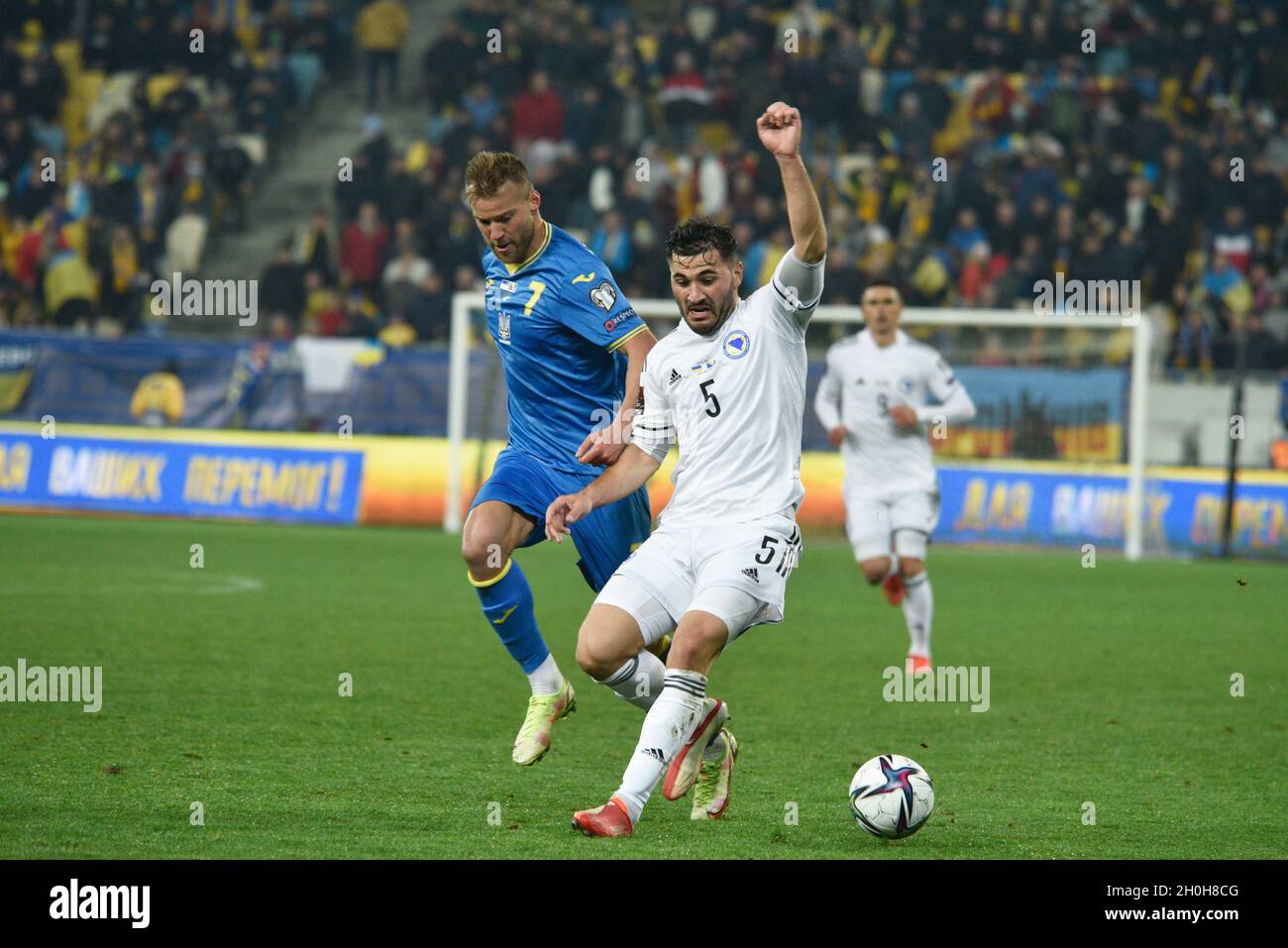 LVIV, UKRAINE - OCTOBER 12, 2021 - Players of the national team of Ukraine Andrii Yarmolenko (R) and Bosnia and Herzegovina Sead Kolasinac fight for the ball during the 2022 FIFA World Cup qualifying matchday 8 game which ended in a draw 1:1, Lviv, western Ukraine Stock Photo