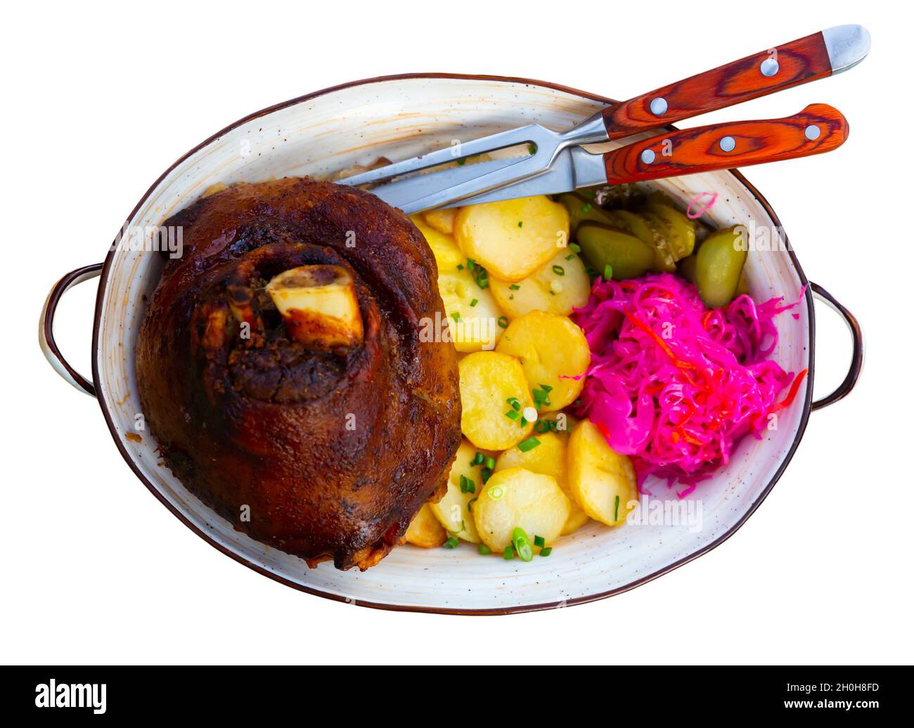 German pork hock with sliced potato and marinaded foods Stock Photo Alamy