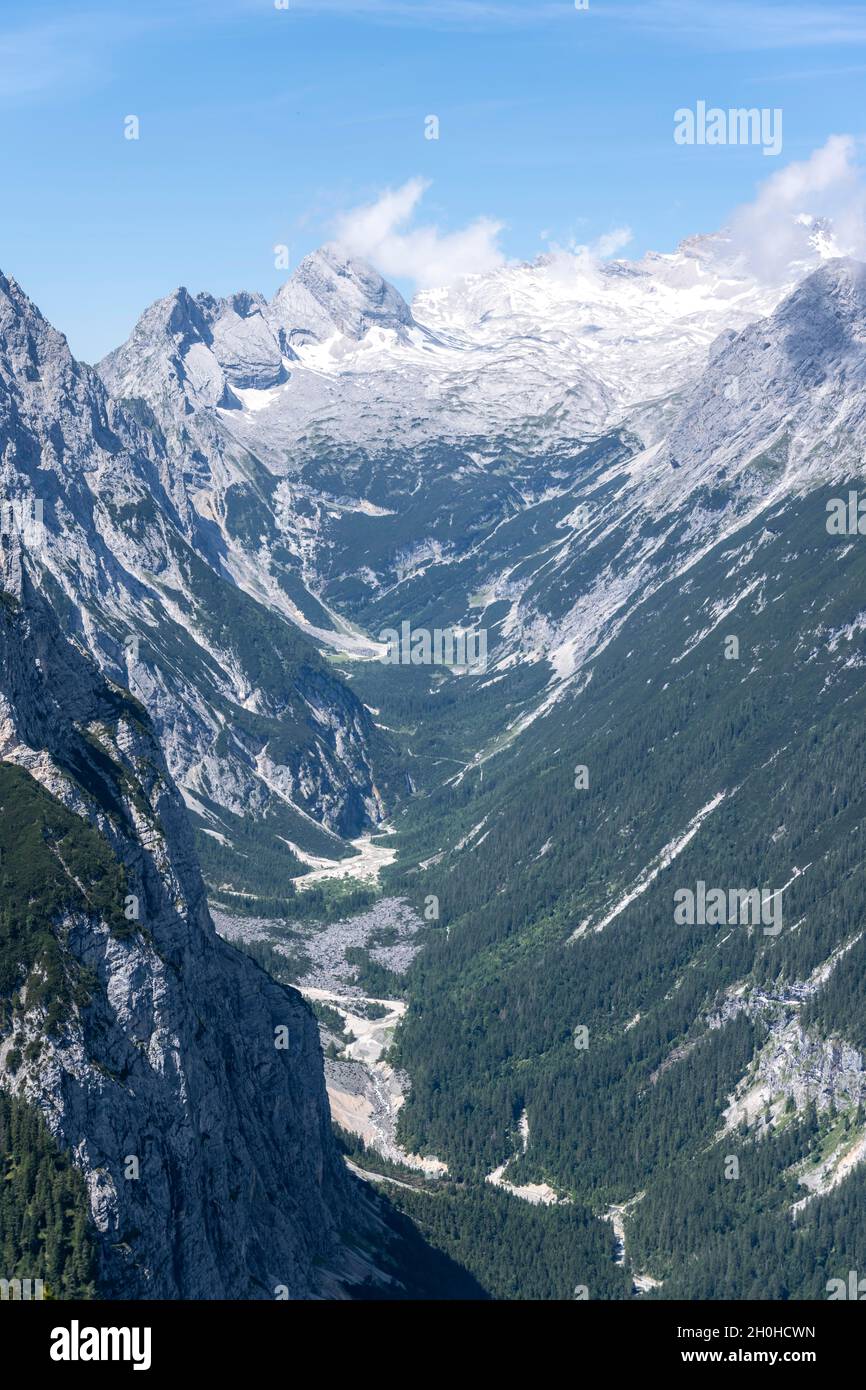 Reintal, behind Zugspitze with glacier Zugspitzplatt, hiking trail to Meilerhuette, Wetterstein Mountains, Garmisch-Partenkirchen, Bavaria, Germany Stock Photo