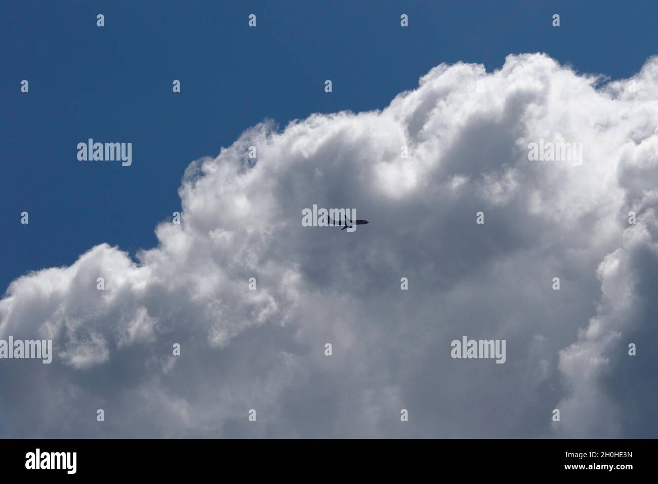Passenger plane in cloudy sky, Province of Quebec, Canada Stock Photo