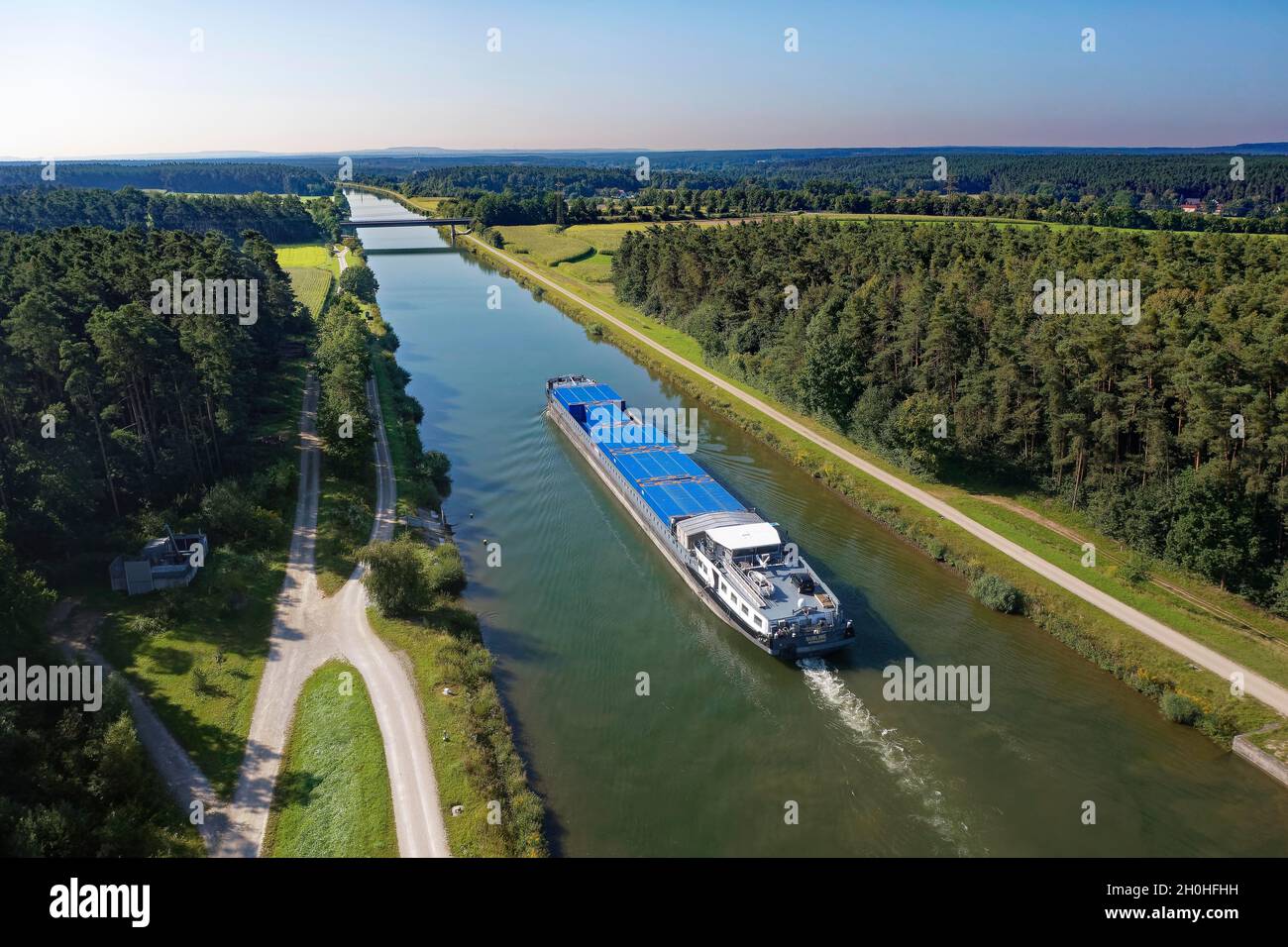 Aerial view, cargo ship, container ship, barge loaded with containers sailing on the Main-Danube Canal near Katzwang, district of Nuremberg, Middle Stock Photo