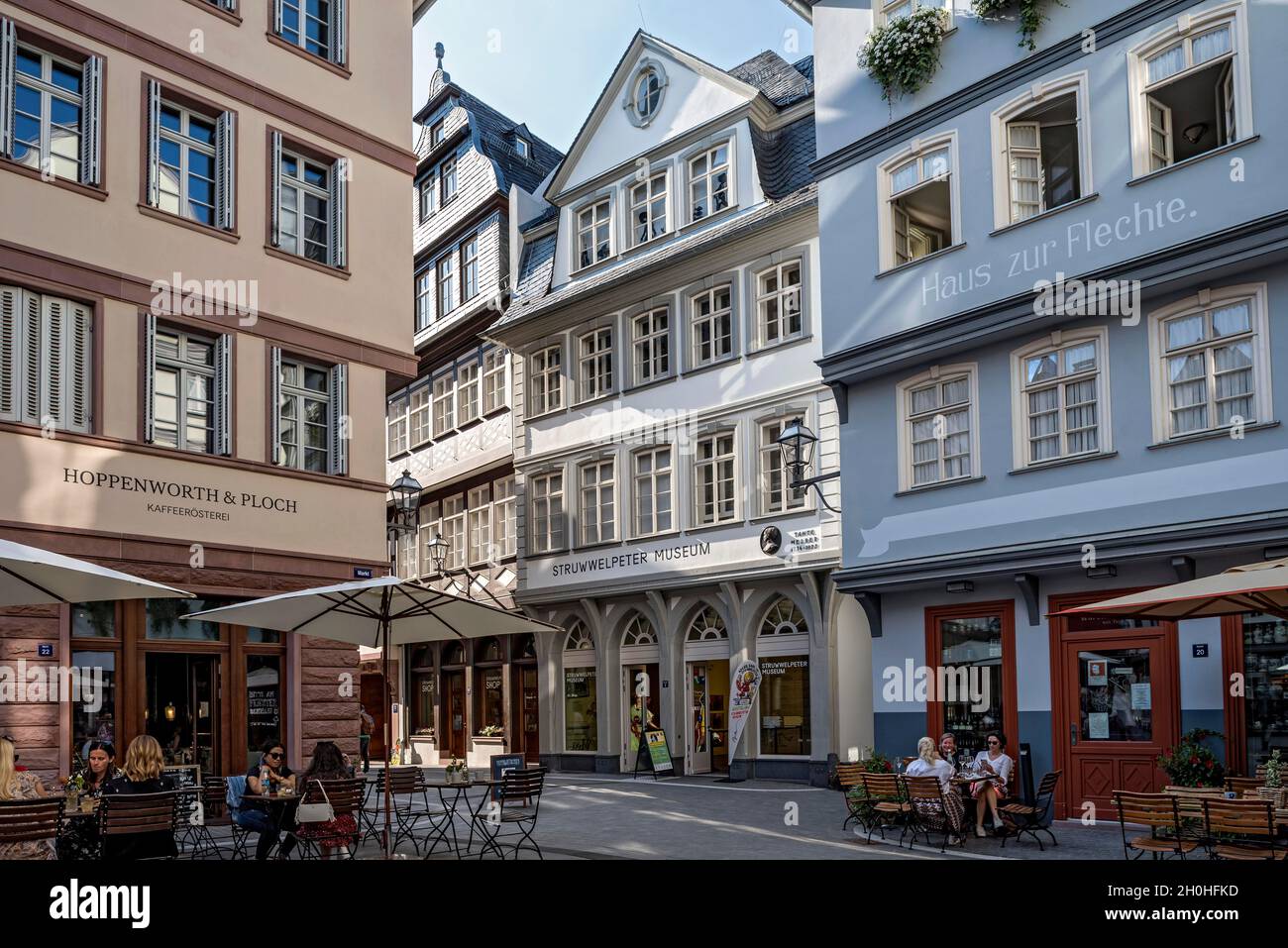 Reconstructed town houses with shops, street cafes and Struwwelpeter Museum, Hinter dem Laemmchen and Huehnermarkt, New Frankfurt Old Town Stock Photo