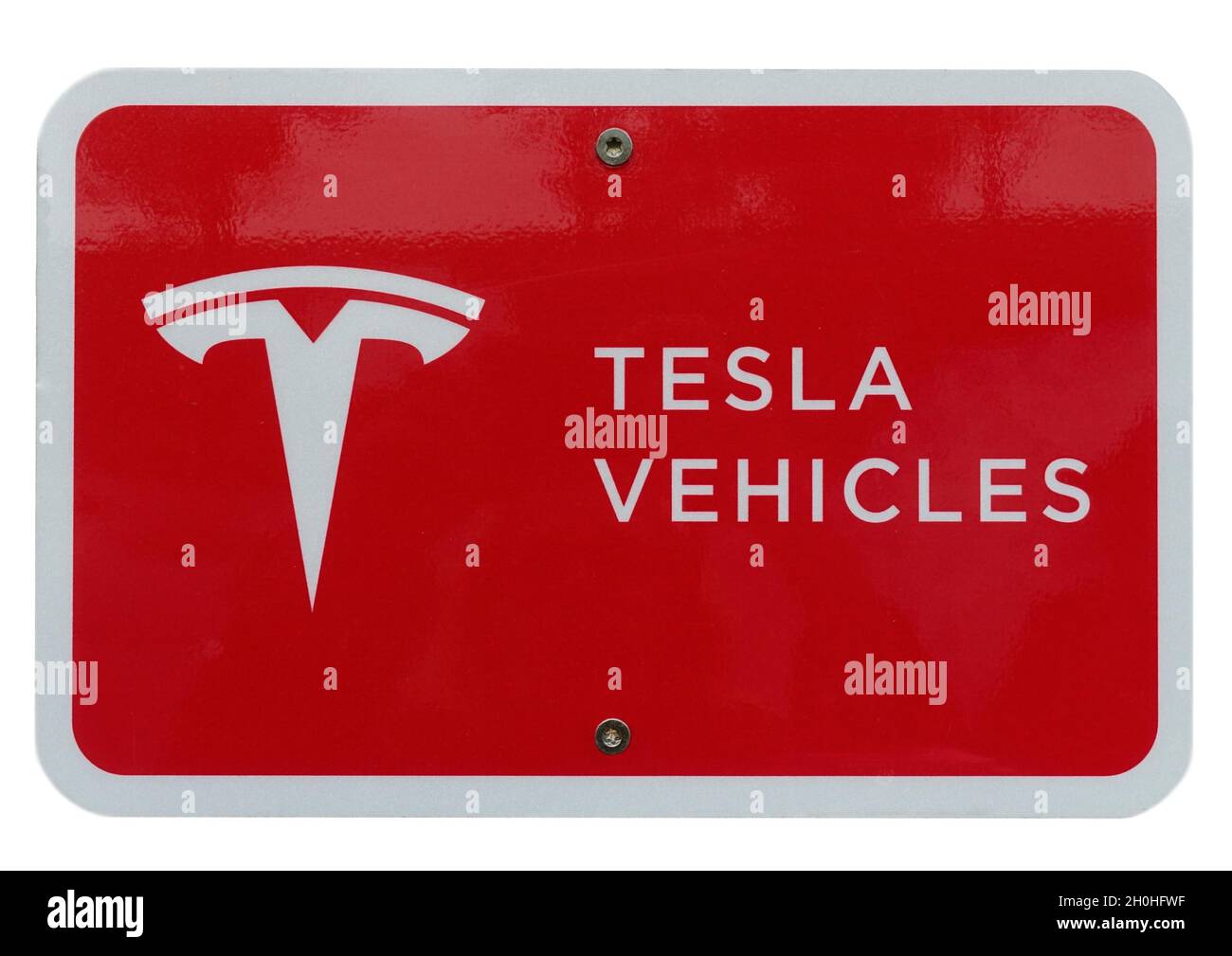 On a house wall hangs a sign from Tesla Vehicles, Achleiten, Upper Austria, Austria Stock Photo