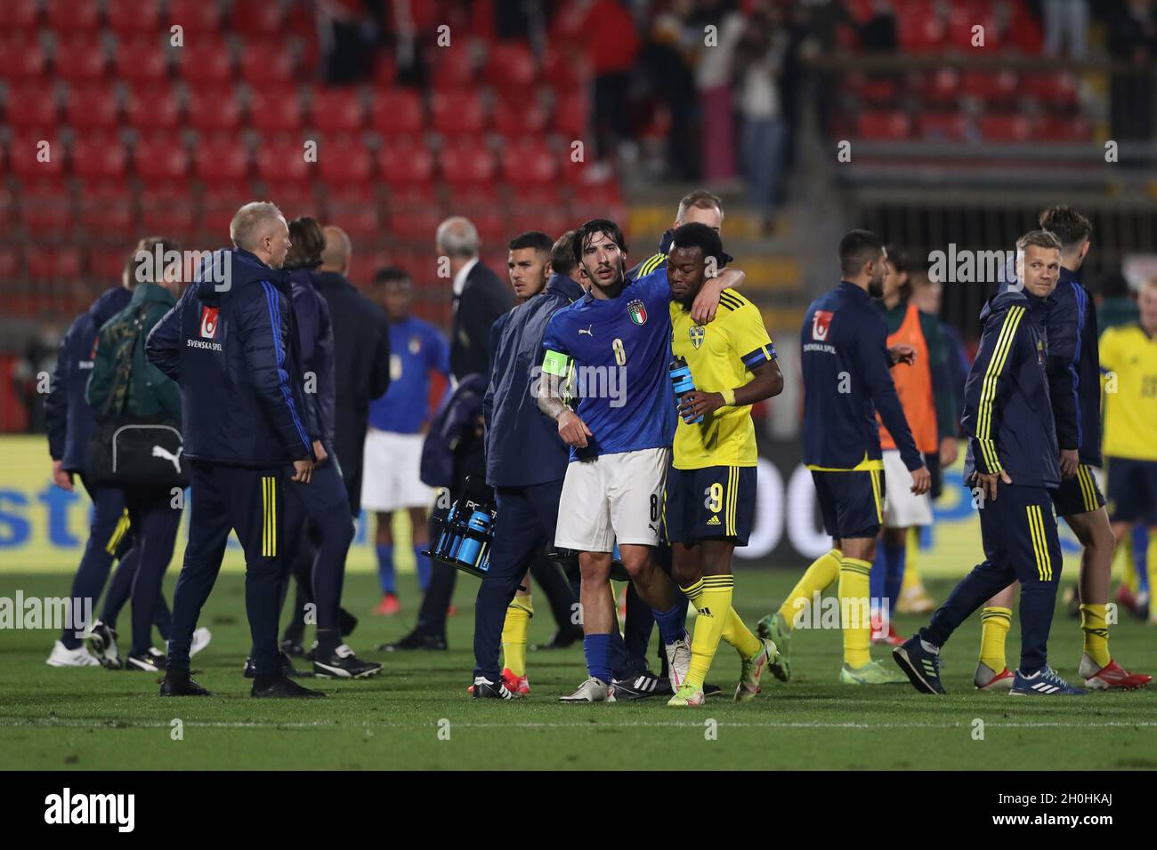 Monza, Italy. 12th Oct, 2021. Sandro Tonali of Italy discusses with Anthony Elanga of Sweden as he embraces him following the final whistle after the Swedish striker mocked the Italy fans after his team mate Tim Prica scored a last minute equalizer in the UEFA Euro Under-21 Qualifying match at Stadio Brianteo, Monza. Picture credit should read: Jonathan Moscrop/Sportimage Credit: Sportimage/Alamy Live News Stock Photo