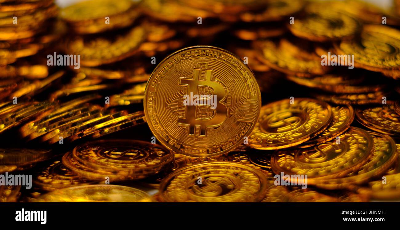 Bitcoin cryptocurrency on pile gold coins a lot of Stock Photo - Alamy