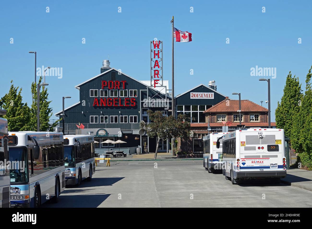 Port Washington, WA / USA - June 22, 2021: The Port Angeles Wharf is shown from an exterior view during a summer day. For editorial uses only. Stock Photo
