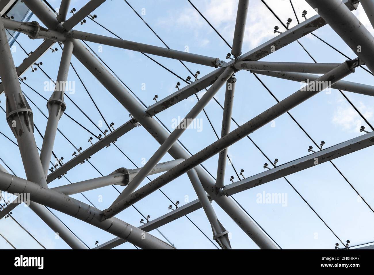 Abstract contemporary architectural photo. Internal structure of roof with metal frame and glass Stock Photo