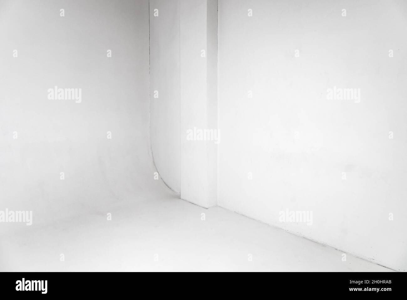 Abstract empty white photo studio interior background, cyclorama structure with smooth transition between horizontal and vertical planes Stock Photo