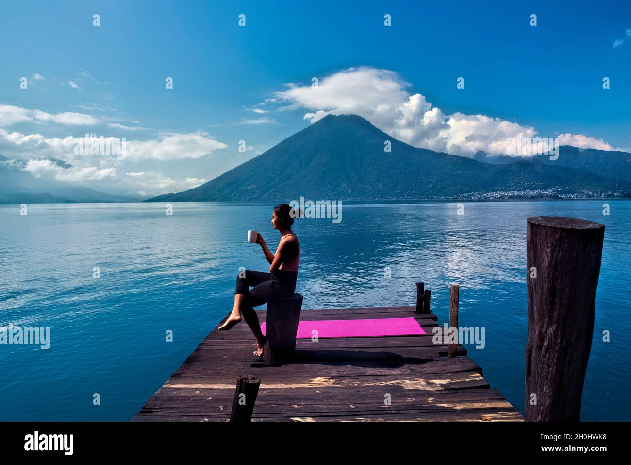 Morning coffee on the dock, San Marcos, Lake Atitlan, Guatemala Stock Photo