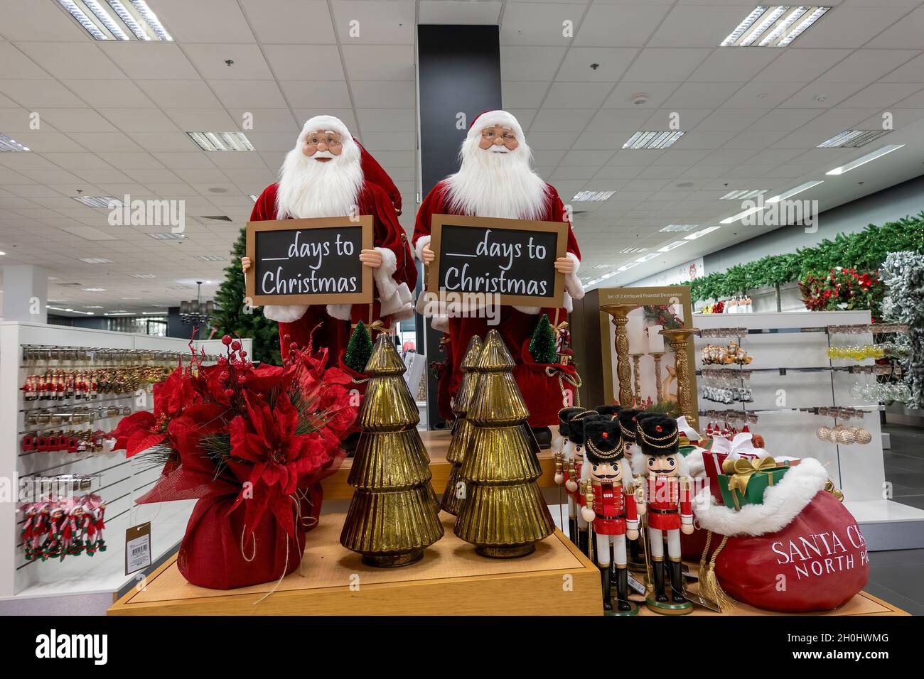 Mackay, Queensland, Australia - October 2021: Department store santa clauses and Christmas decorations Stock Photo