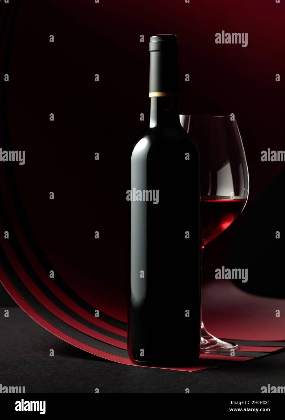 Bottle and glass of red wine. Copy space for your text Stock Photo - Alamy