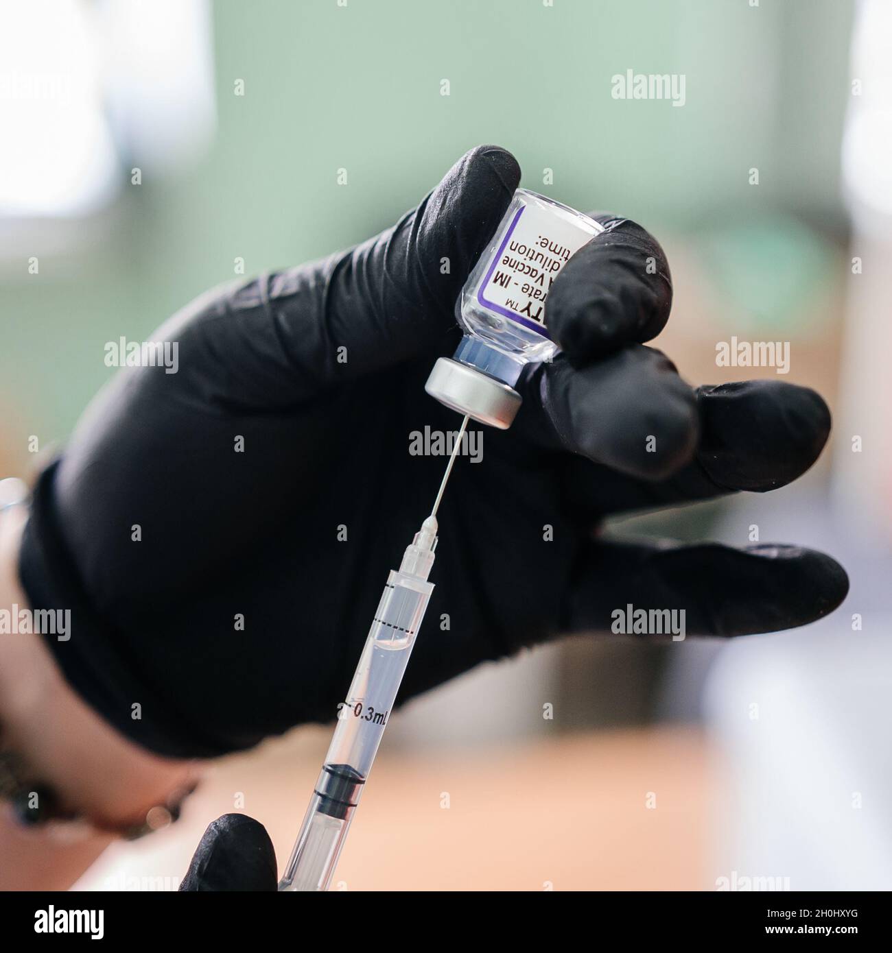 Kalush, Ukraine September 14, 2021: anti-viral vaccine pfizer in a vial against covid infection, vaccination in Ukraine. Stock Photo